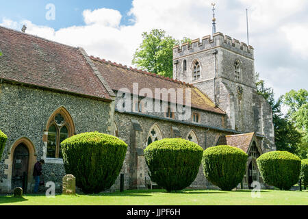 St. Mary`s Parish Church, Wendover, Bucks, UK, showing the church clock tower, and trimmed shrubs Stock Photo